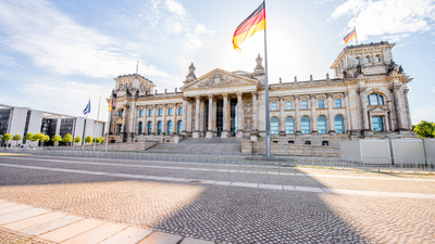 View on the famous Reichtag parliament building with flag during the morning light in Berlin city